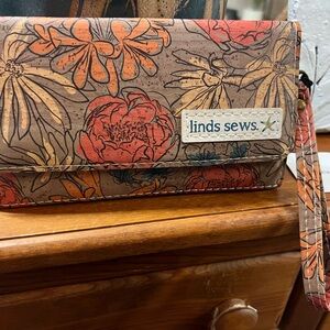 Cork wallet with removable wrist strap featuring an Orange and Brown Design